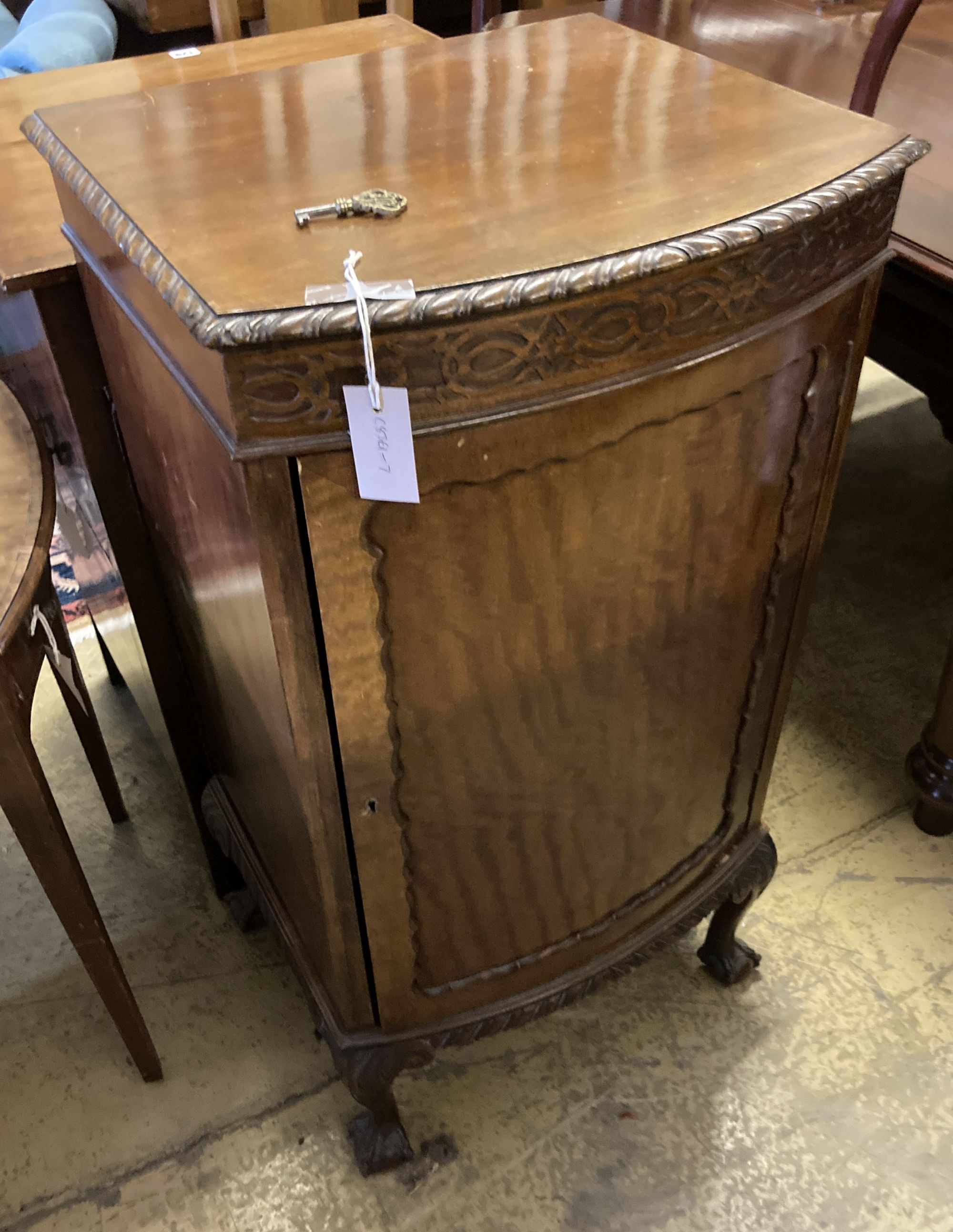 A 1920s Chippendale revival mahogany bowfront pier cabinet, width 50cm, depth 44cm, height 96cm